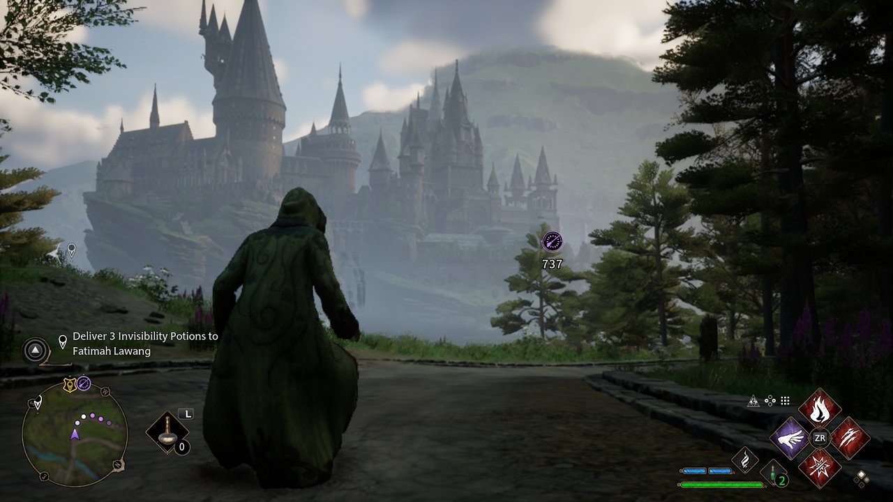 Hogwarts Legacy: the castle on its cliff seen from a path in daylight