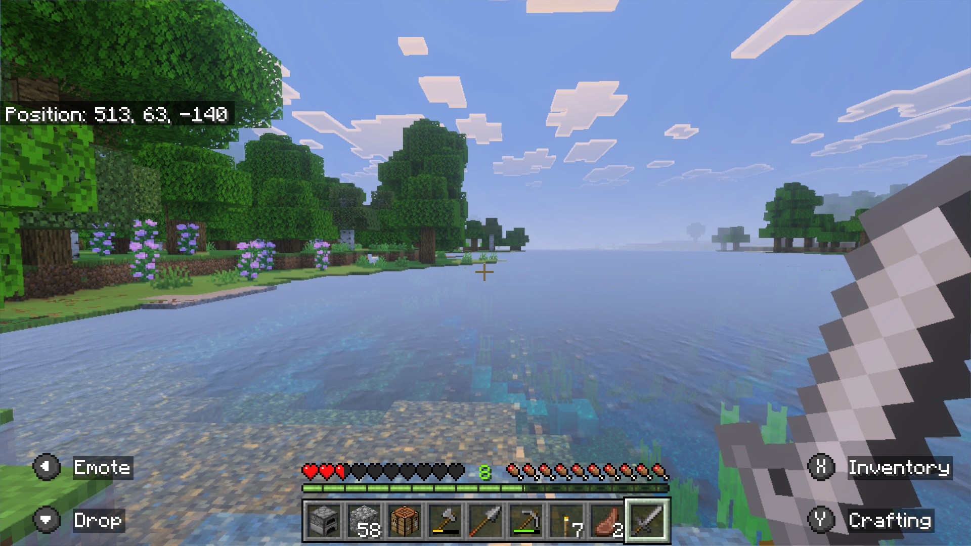 Minecraft: a lake with purple flowers and oak trees on the shore