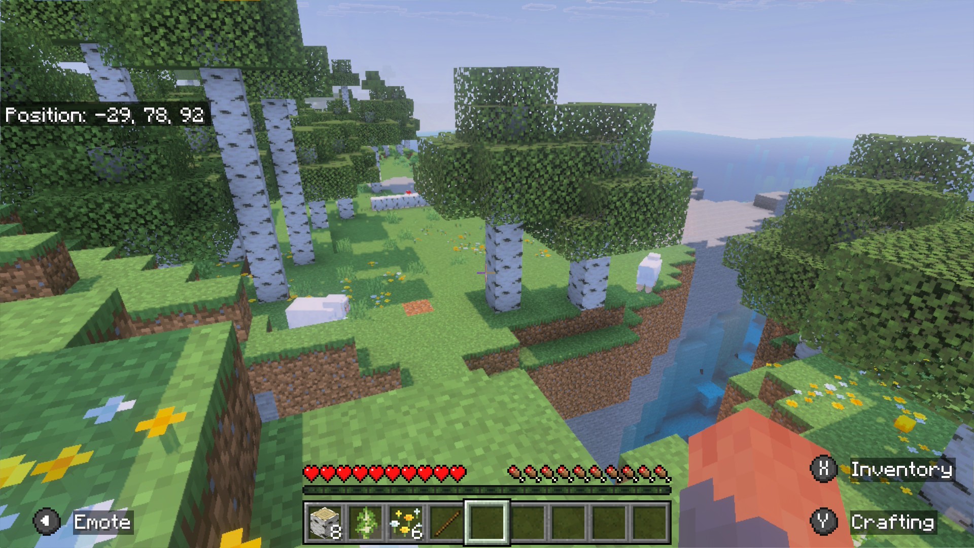 Minecraft: sheep on a grassy cliff above a waterfall in a birch forest
