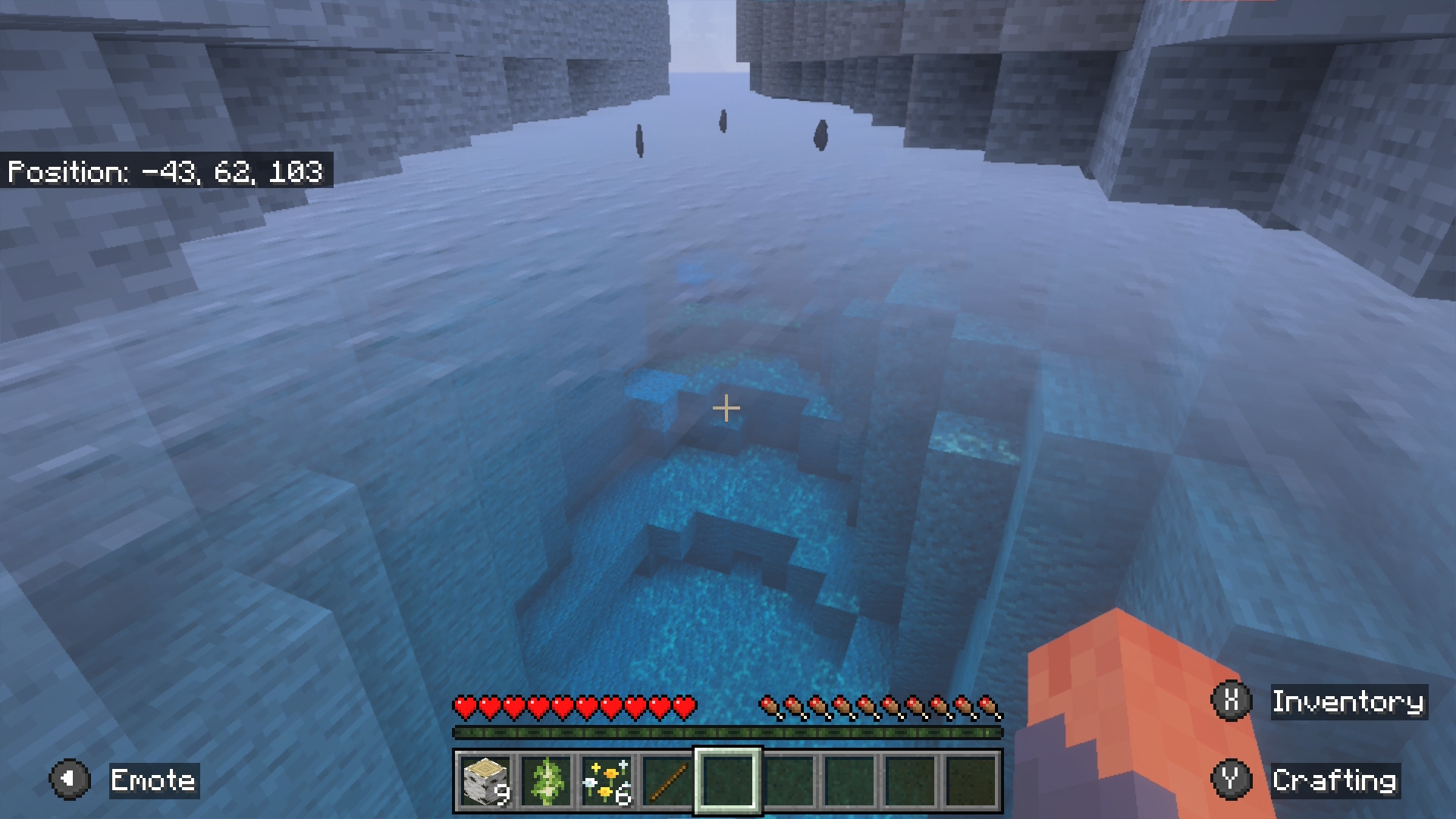 Minecraft: a misty ocean with stone cliffs and a dark underwater ravine
