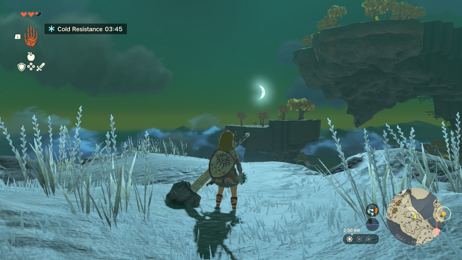 A frozen sky island at night, with a moon that deserves a screenshot. Brr.
